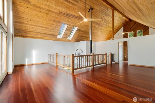 Soaring vaulted ceilings, rich wood finishes, and a wall of windows that brings the outdoors in—this upstairs retreat is both dramatic and serene. Whether you envision a family room, creative studio, or expanded en suite, the layout offers endless flexibility. Virtual remodel shown to spark inspiration.