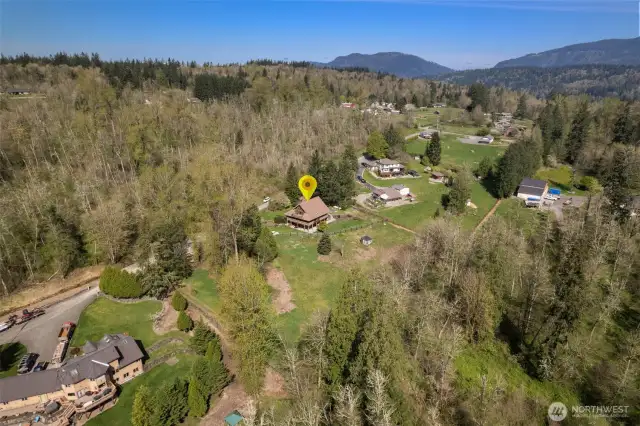 Tucked away on over two acres of lush