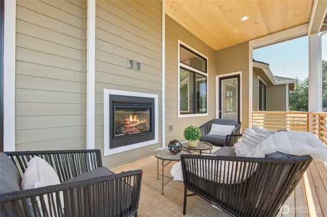 A double-sided fireplace adds an element of coziness to both the interior and the covered deck.