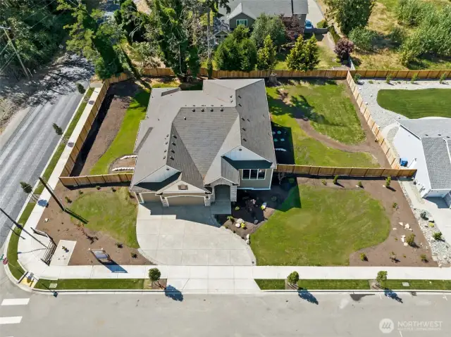 Majestically situated on over 1/2 on a fully landscaped corner lot.