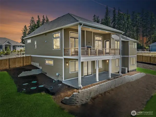 Rear view of this grand daylight basement rambler.