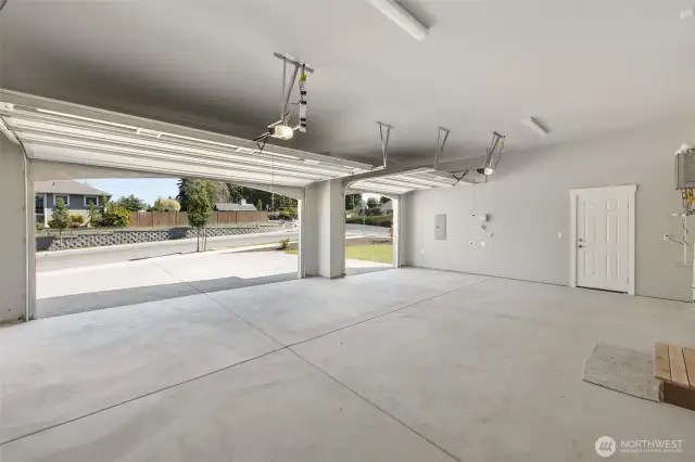 The 3 car garage has been fully finished, and even includes an extra niche for storage or work bench.