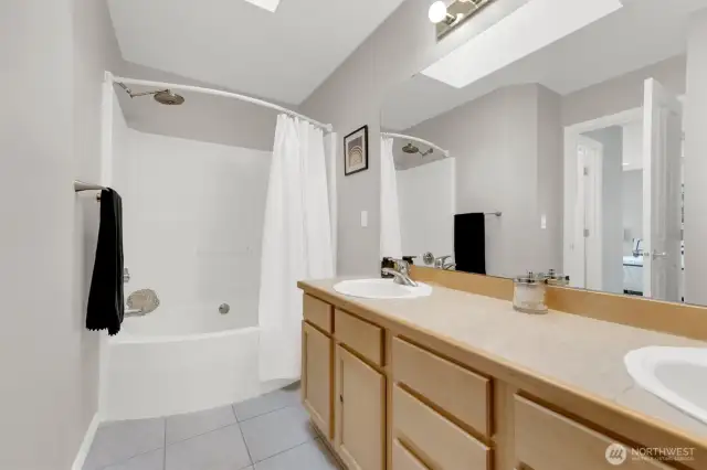 Primary bathroom with big soaking tub/shower & dual sink vanity