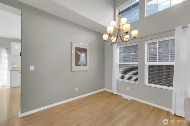 Formal dining room w/ tall ceilings & large windows for extra natural light