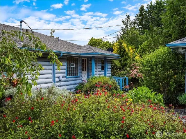 The property is surrounded by beautiful garden spaces.