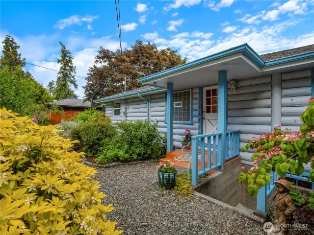 Covered front entry with cute Dutch door.
