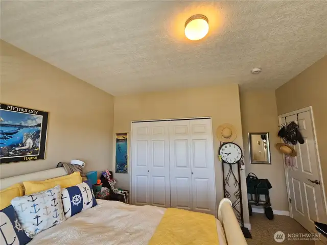 Spare large bedroom, with a large window for lots if light, and views.