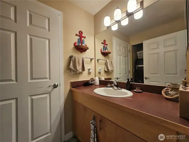 Guest bathroom right off the kitchen for easy access.