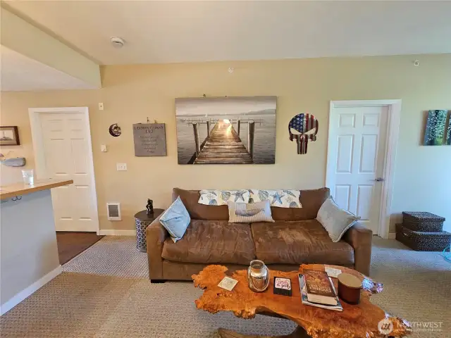 Living room is perfectly between the kitchen and back patio.