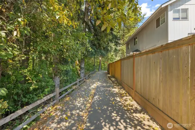 Walkway next to house to the community field.