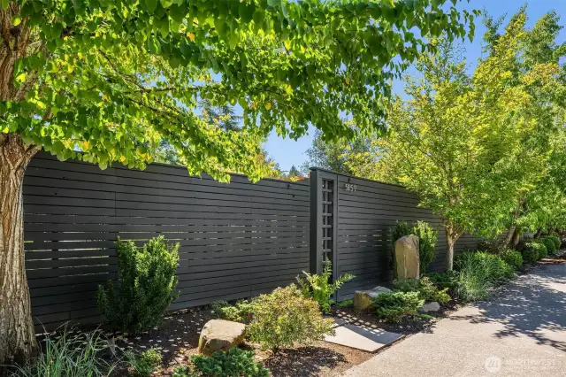 The front courtyard is tucked behind this discreet, private entry gate.
