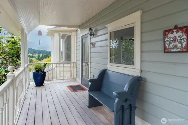 Covered front deck. Front door leads to two doors- one is the main level- 909. The other is upstairs- 913.