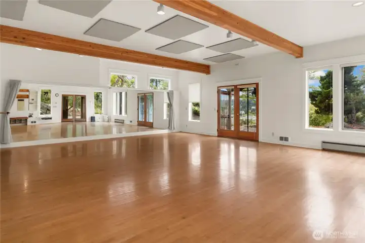 Studio on the lower level has been a movement room for years. Ballet, yoga, Tai chi. It could be a workshop, art studio, I suppose even an ADU with a bit of remodeling.