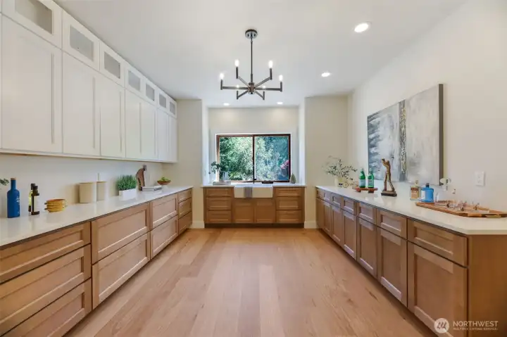 Whoa! HUGE Butler’s Pantry:    Custom cabinetry with abundant storage  Quartz counters & prep sink for catering or party staging  Dedicated wine fridge connection  Perfect for coffee station, bar service, or extra food prep area