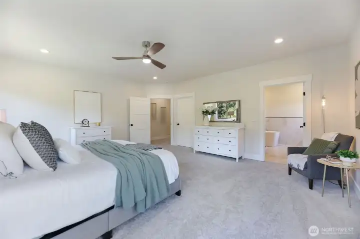 The closed door in the distance opens to the big walk-in closet.