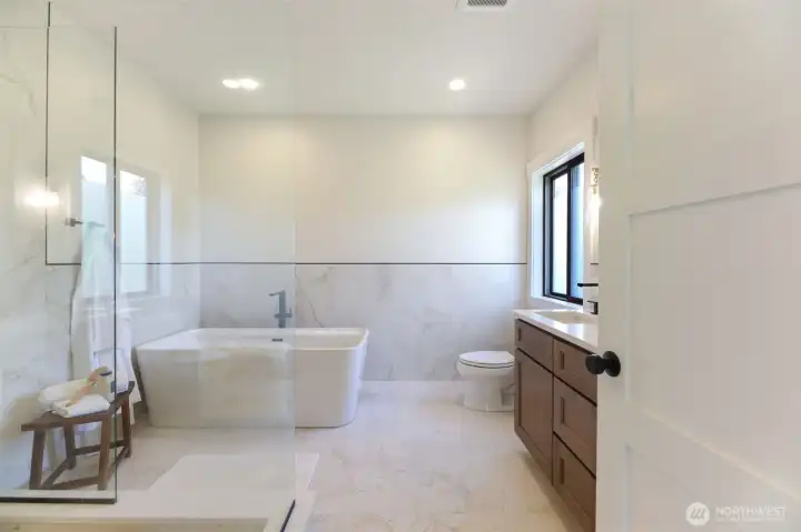 You are absolutely going to love this spa-inspired bath! No expense spared here. All stone, tile, glass surround shower, large soaking tub, dual vanity... everything with high-end finishes.