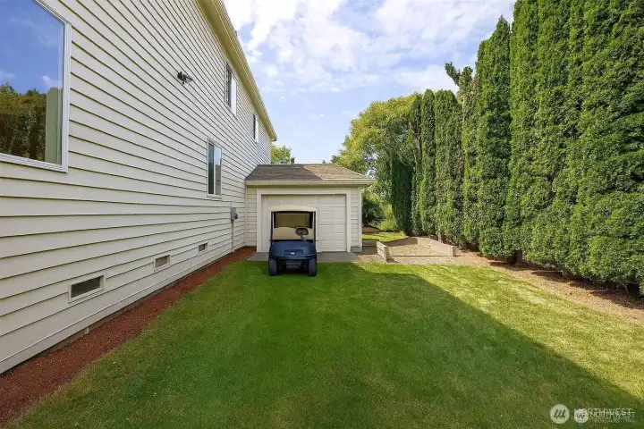 Drive from your home right on to the 11th Tee. Plenty of space for you to add a separate golf cart garage! Here is a rendering of adding a door to the garage. Other idea is to add on.