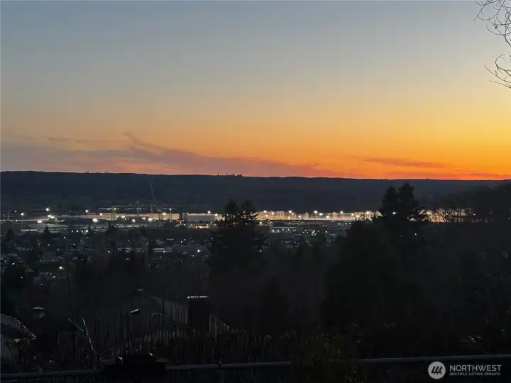 Watch the sunset and the harbor lights come on.