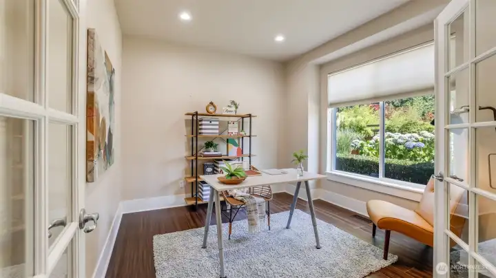 Enjoy this main floor office/flex space with glass pane french doors.