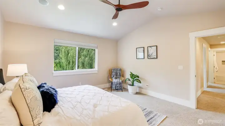 Ample space in this primary for furniture and a seating area to truly make this your own little retreat!