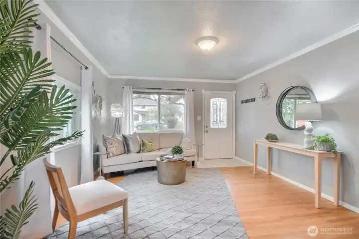 Step into the warm and inviting living room with real hardwoods.