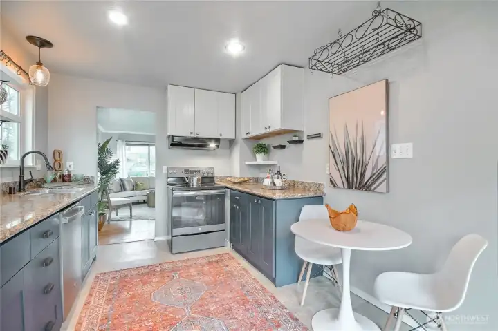 The kitchen has been thoughtfully refreshed with newly painted cabinetry and stylish new pulls, providing a clean updated look while maintaining the home’s character.