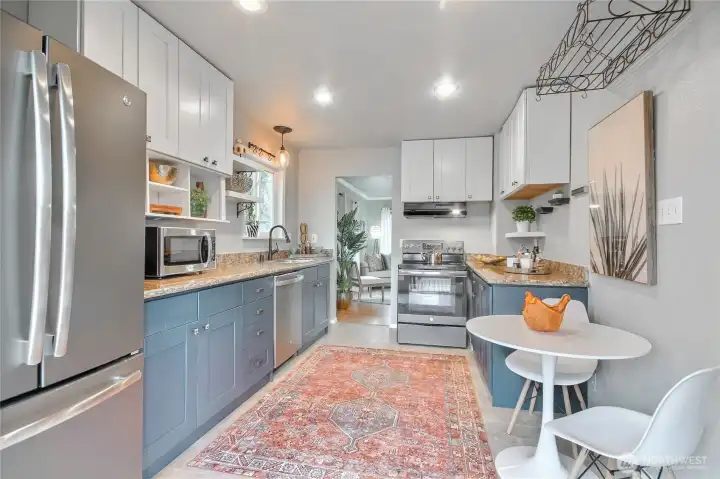 Kitchen features all stainless steel appliances with a sleek three door refrigerator provides ample storage and a   Polished,modern look