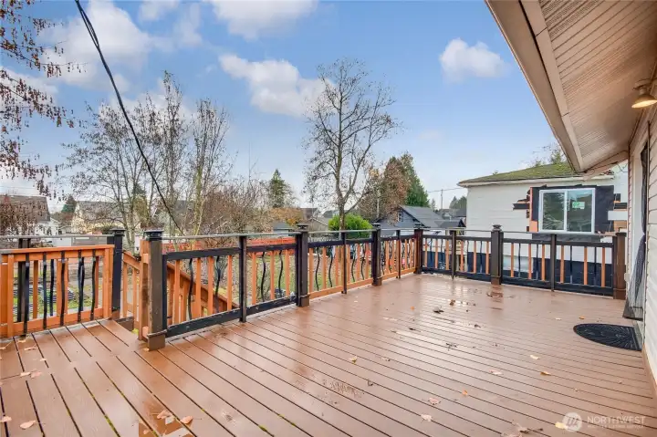 Spacious entertainment size Trex deck confidently located off the kitchen