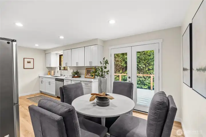 Manicured with beautiful natural lighting, this kitchen with eating space brings people together, and keeps the conversations flowing.