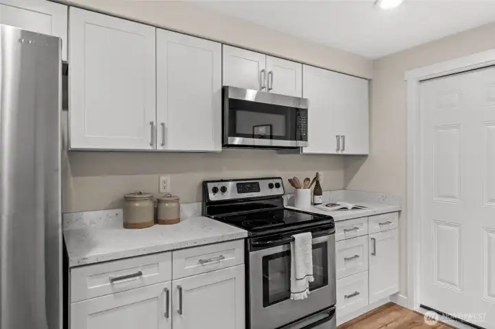 Sleek, sophisticated, and clutter-free. With floor-to-ceiling custom cabinetry, beautiful quartz countertops, and a minimalist aesthetic, this kitchen proves that high style and high function go hand-in-hand.