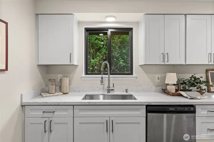 Gaze out to your gorgeous backyard while doing the dishes in your brand new farm-style commodious sink.
