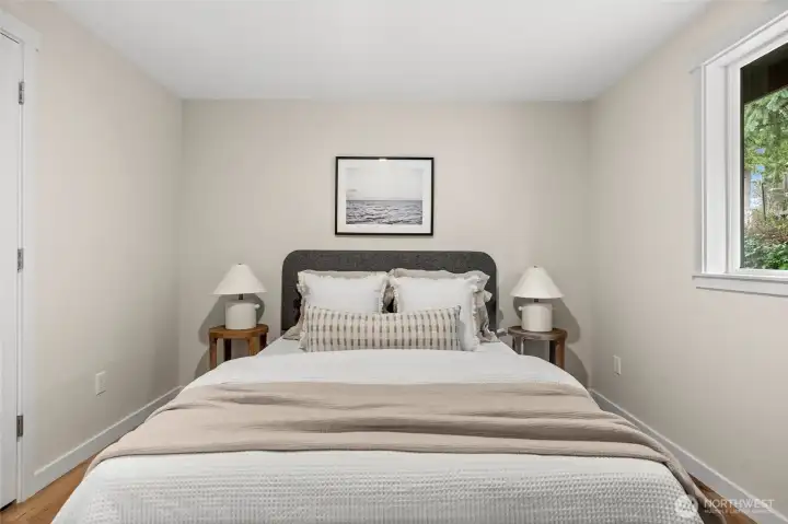 This well-appointed third bedroom offers ample closet space and a peaceful atmosphere.