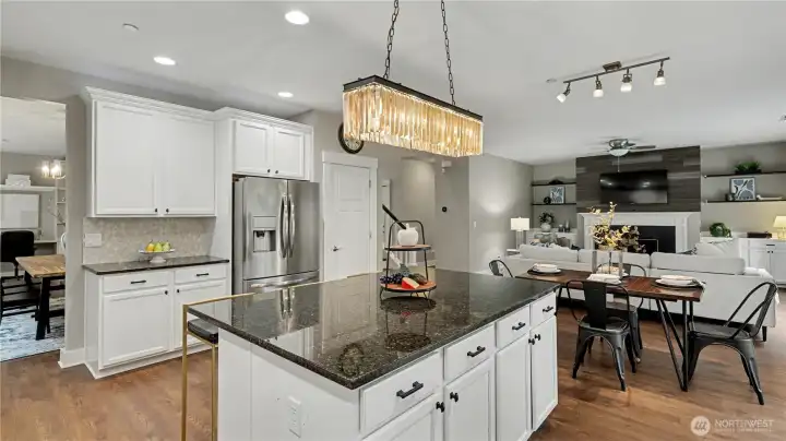 A spacious kitchen with a large island offers the perfect space for cooking, gathering, and entertaining.