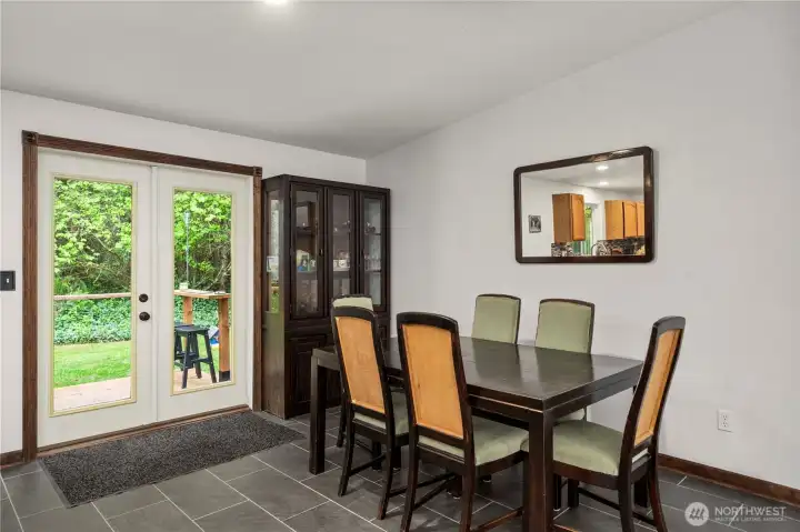 Large dining room over looks back deck
