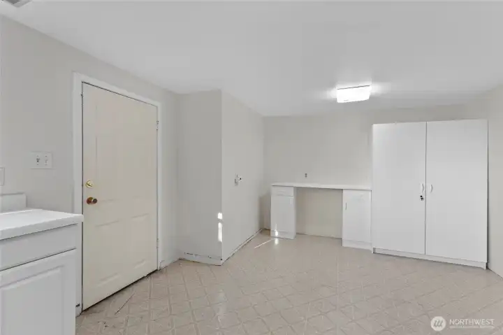Large laundry and utility/mud room, opens to backyard