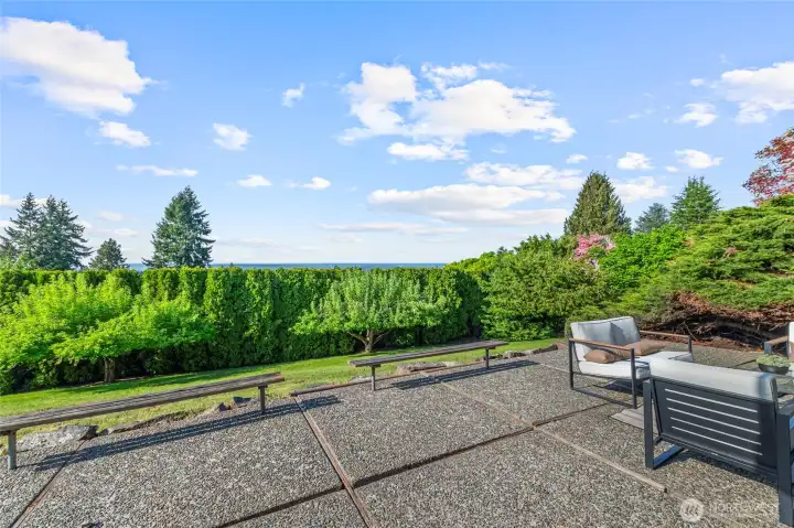 Lower level oversized patio, surrounded by privacy trees