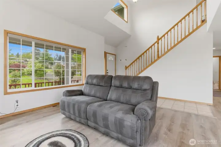 Vaulted ceilings and abundant windows fill the living space with natural light while creating an open, airy feel throughout the home.