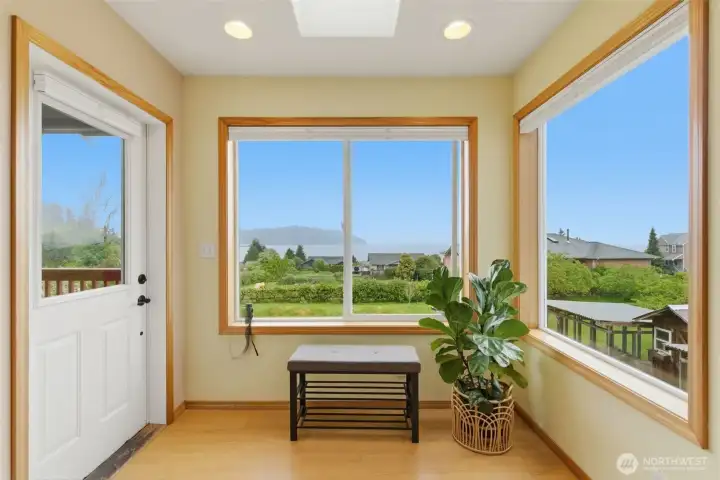 Cozy nook area with access to the deck—an ideal spot to relax with a cup of coffee and watch the ferry come and go across the Sound.