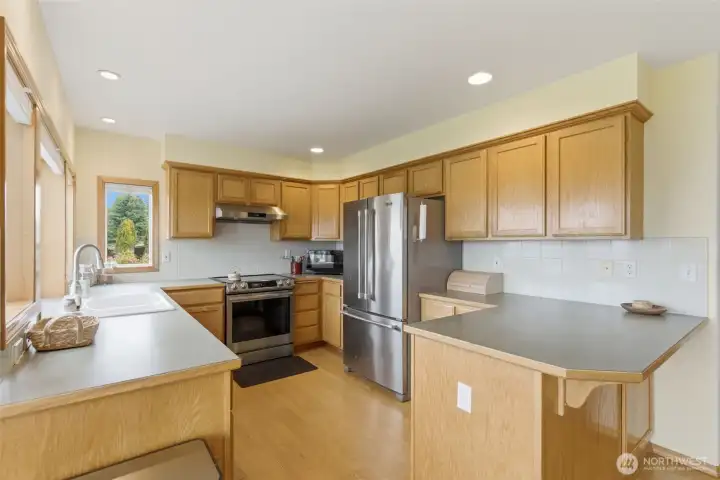 Updated kitchen features stainless steel appliances and a functional layout designed for everyday living and easy entertaining.