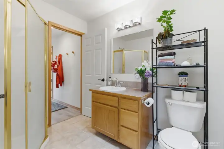 Convenient 3/4 bathroom located on the main level just off the bonus room—ideal for guests or flexible living arrangements.