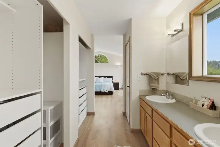 Closet organizer system helps maximize storage and keeps everything neatly arranged and easy to access.