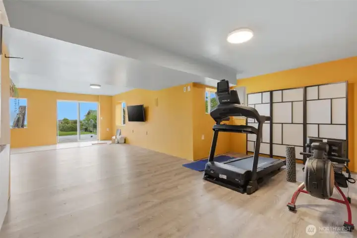 Another perspective of the spacious lower level—showcasing the flexibility and room for entertaining, relaxing, or multi-purpose living.