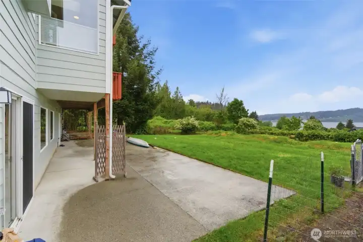 Large yard offers plenty of space and opportunity for gardening, outdoor projects, or simply enjoying the natural surroundings.