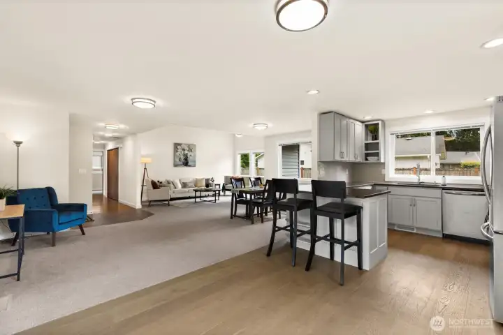From the kitchen, the entire main living area opens up. Plenty of room to spread out and entertain. From the kitchen, the entire main living area opens up. Plenty of room to spread out and entertain.