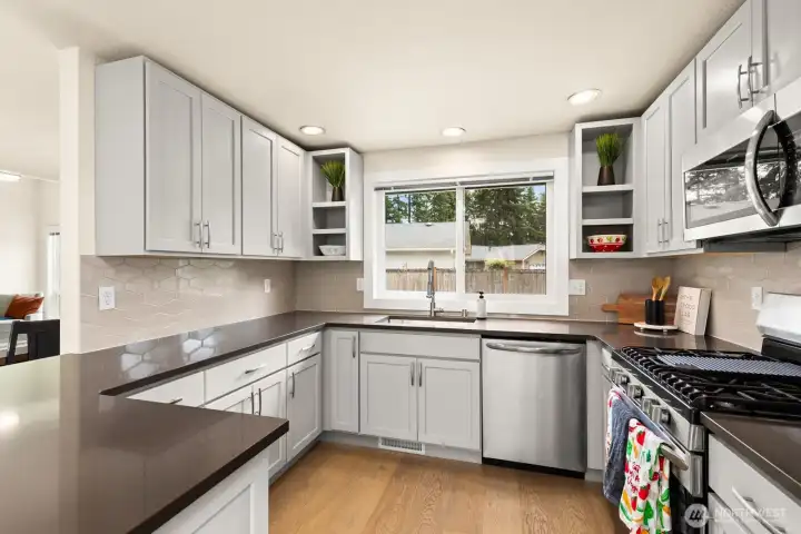 Gorgeous kitchen with soft-close hardware and a stone countertop. Gorgeous kitchen with soft-close hardware and a stone countertop.
