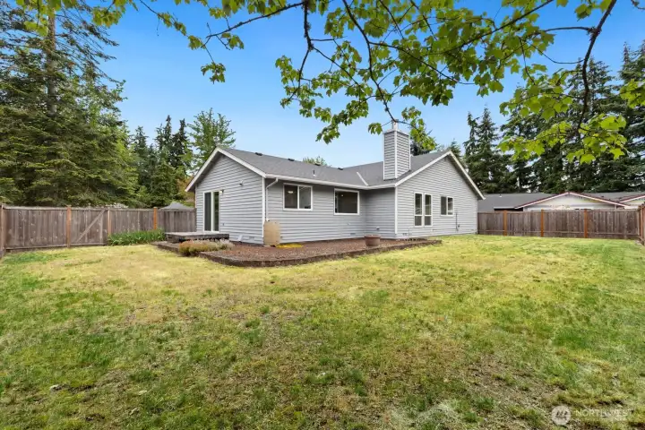 Fully fenced, flat backyard with plenty of room to play, garden, or just enjoy the PNW outdoors. Fully fenced, flat backyard with plenty of room to play, garden, or just enjoy the PNW outdoors.