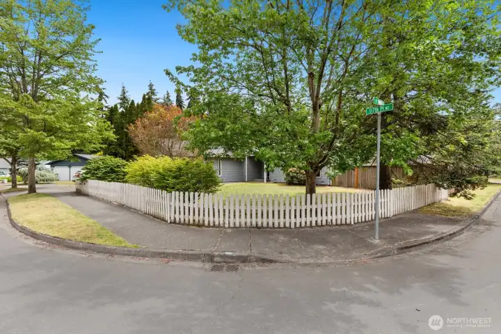 Corner lot with the classic white picket fence. Corner lot with the classic white picket fence.