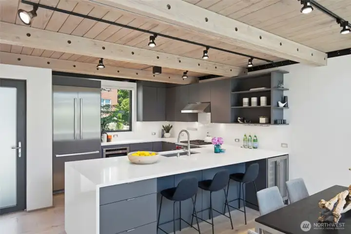 Wolf® range, Bosch® refrigeration, Pental® quartz counters, and a Starphire® glass backsplash. Wolf® range, Bosch® refrigeration, Pental® quartz counters, and a Starphire® glass backsplash.