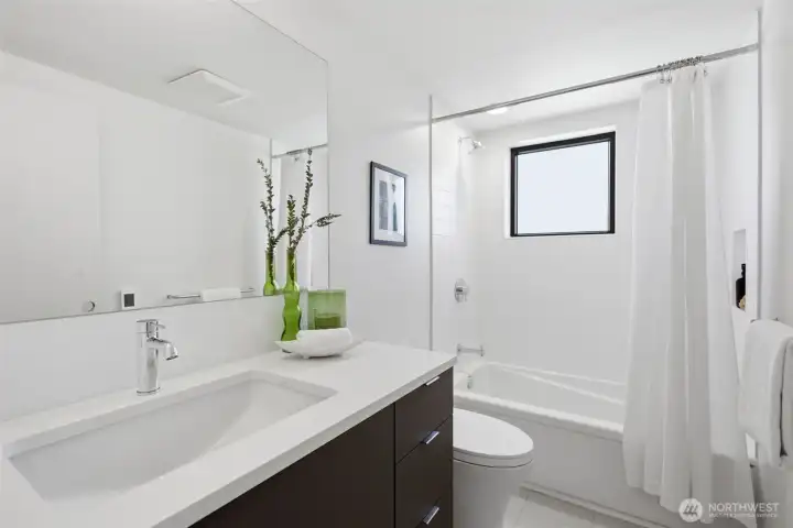 Pental® stone counters and frameless "float" mirrors, with Grohe® fixtures throughout. Pental® stone counters and frameless "float" mirrors, with Grohe® fixtures throughout.