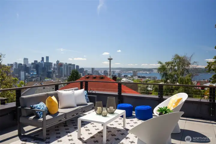 590 square feet of private rooftop space, anchored by a custom NewAge® outdoor kitchen — BBQ, refrigerator, quartz counters, custom cover. Professionally installed, no expense spared. Dinner with a skyline view. 590 square feet of private rooftop space, anchored by a custom NewAge® outdoor kitchen — BBQ, refrigerator, quartz counters, custom cover. Professionally installed, no expense spared. Dinner with a skyline view.